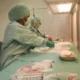 Clean and sterile medical environment with equipment and protective barriers.