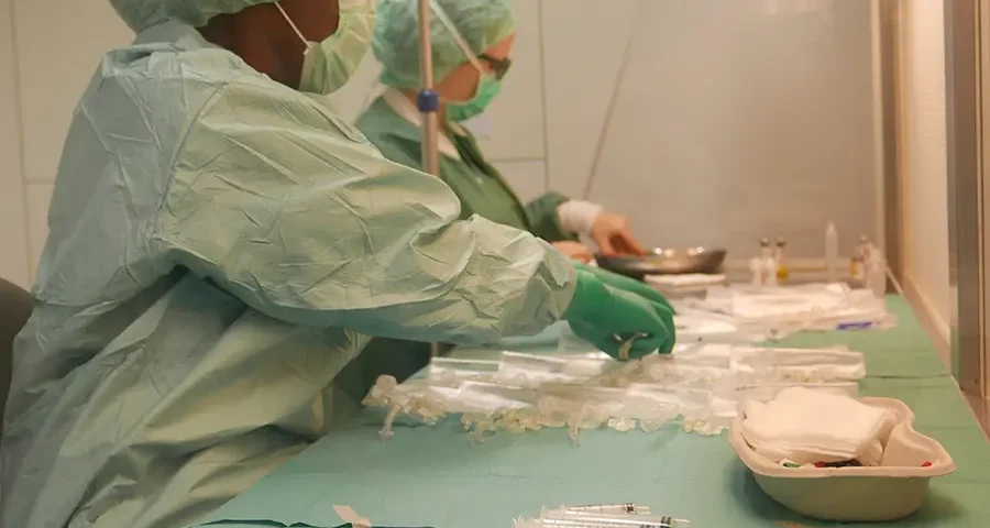 Clean and sterile medical environment with equipment and protective barriers.