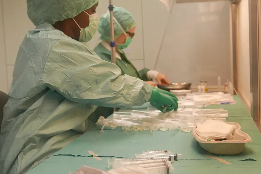 Clean and sterile medical environment with equipment and protective barriers.