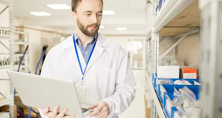 Technical engineer preparing medical goods for export in a modern distribution facility.