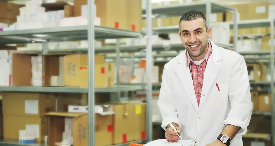 Medical supply warehouse with workers organizing products and preparing shipments.