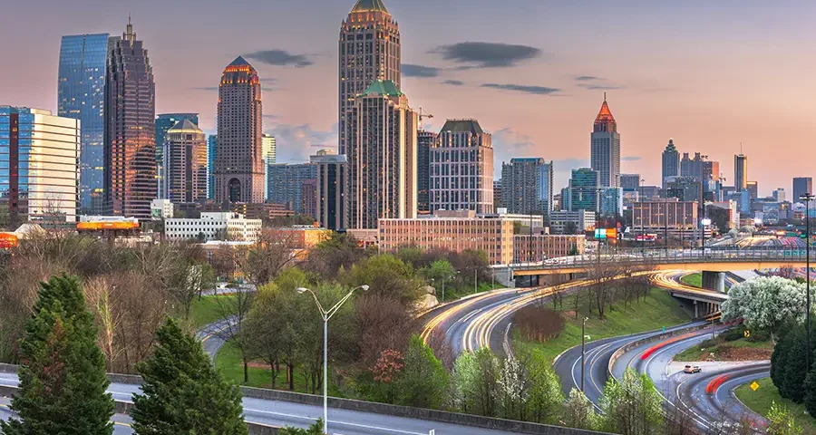 View of downtown Atlanta, Georgia, with tall buildings and clear skies.