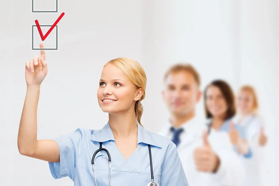 Young healthcare professional marking a checkbox, indicating verified medical supplies.