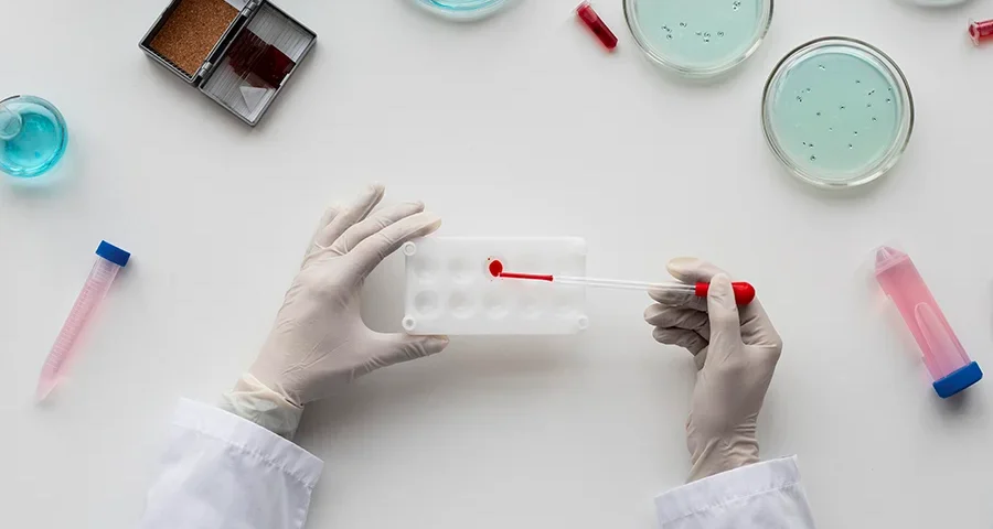 Close-up of a scientist using a pipette, ideal for illustrating lab practice with expired or surplus materials.