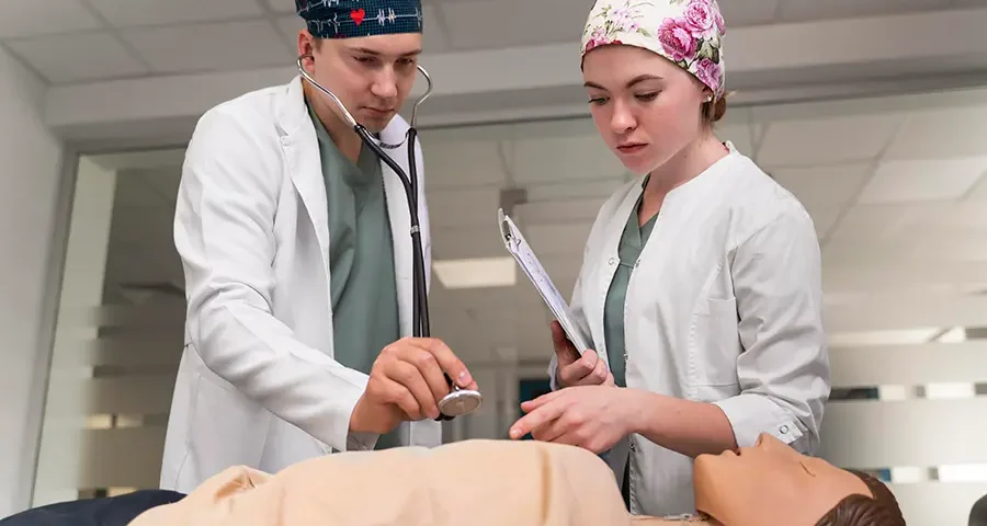 Medical student practicing in a hospital as part of their clinical education.