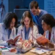Medical students practicing clinical procedures in a hands-on learning environment.