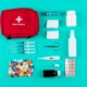 Flat lay of a medical emergency kit with expired or soon-to-expire medical supplies